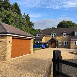a shingle driveway and garage